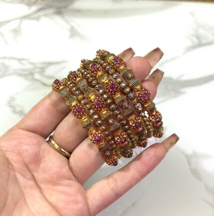 Gold-plated 6-piece bangles set featuring shimmering crystal stones and intricate ethnic designs