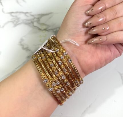 Material: Durable gold-plated alloy Design: Intricate floral patterns with traditional elegance Finish: High-polish gold tone for a radiant shine Style: Ideal for festive events, cultural occasions, and daily ethnic wear Set Includes: Multiple bangles designed in a coordinated floral theme