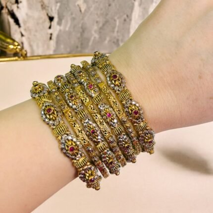uxury gold-plated bangle set featuring maroon stone embellishments and delicate ball detailing