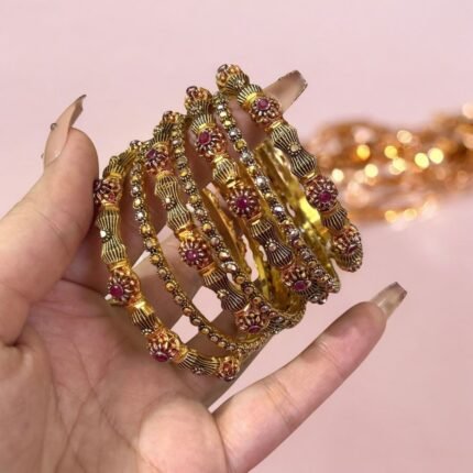 Gold-plated 6-piece bangles set featuring shimmering crystal stones and intricate ethnic designs