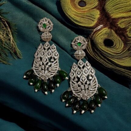 Sparkling diamond-inspired earrings with teardrop pearl accents.