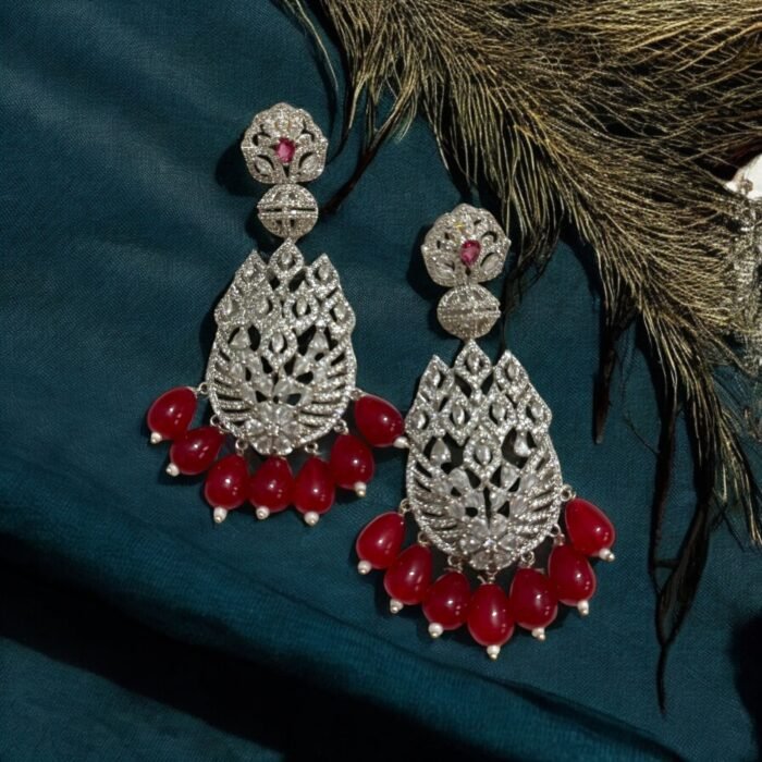 Sparkling diamond-inspired earrings with teardrop pearl accents.