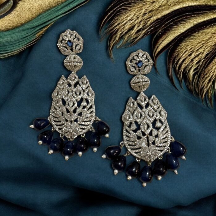 Sparkling diamond-inspired earrings with teardrop pearl accents.
