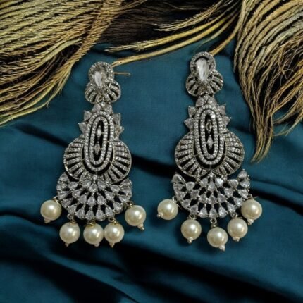 Dazzling crystal earrings with black accents and pearl drops.