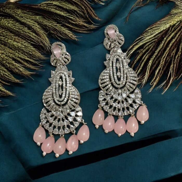 Dazzling crystal earrings with black accents and pearl drops.
