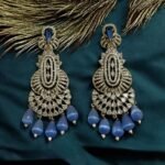 Dazzling crystal earrings with black accents and pearl drops.