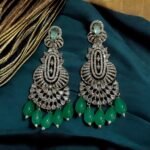 Dazzling crystal earrings with black accents and pearl drops.