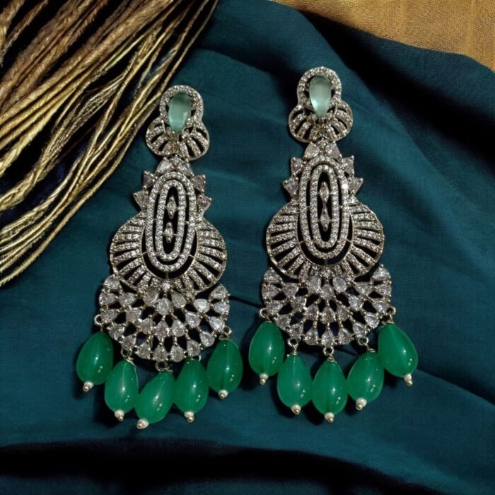 Dazzling crystal earrings with black accents and pearl drops.