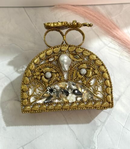 A sophisticated gold clutch with crystal and pearl embellishments, perfect for adding an elegant touch to your formal and evening outfits.