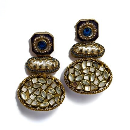 Vintage-style gold earrings with blue and pearl accents, featuring geometric-shaped stones.
