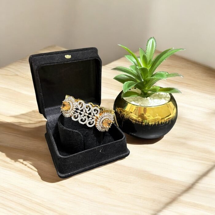 Gold bracelet with citrine stone and crystal embellishments.