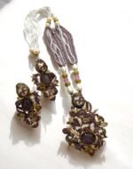 Lavender crystal and pearl necklace with floral pendant, paired with matching earrings.
