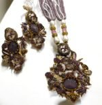 Lavender crystal and pearl necklace with floral pendant, paired with matching earrings.
