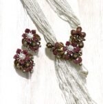 Gold-plated necklace with pink crystals, pearls, and floral accents, paired with matching earrings.