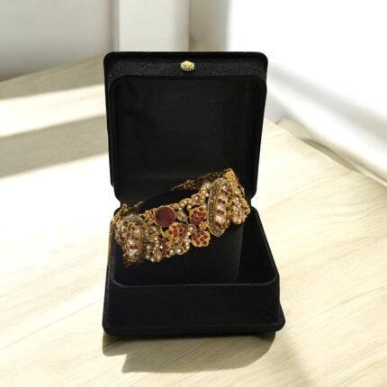 Gold-plated bracelet with red gemstones and pearls, presented in a black gift box.